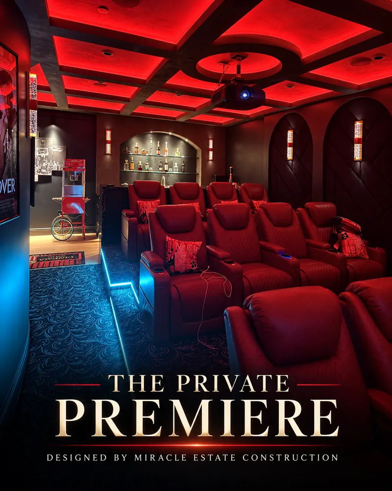 Home theater with red leather recliners, a red-lit coffered ceiling and a projector